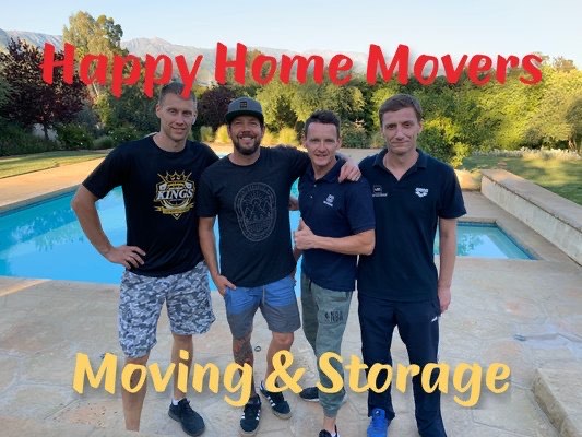 Four Happy Home Movers team members standing together