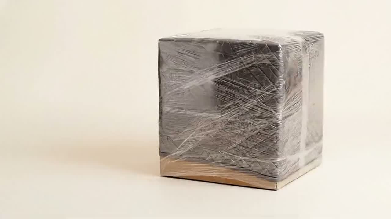 The protected box secured in clear stretch wrap